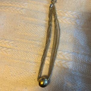 Necklace 18 inches long, 4 chains and large gold bead. Marked Korea